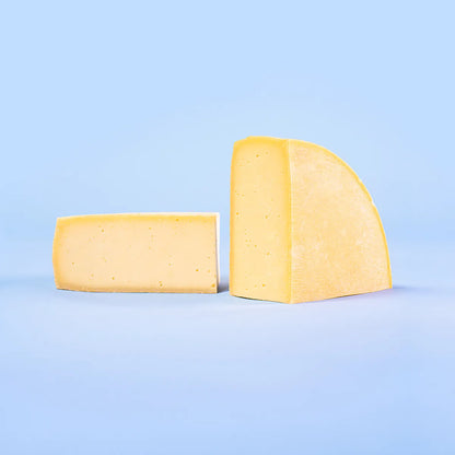 quarter wheel of raclette cheese